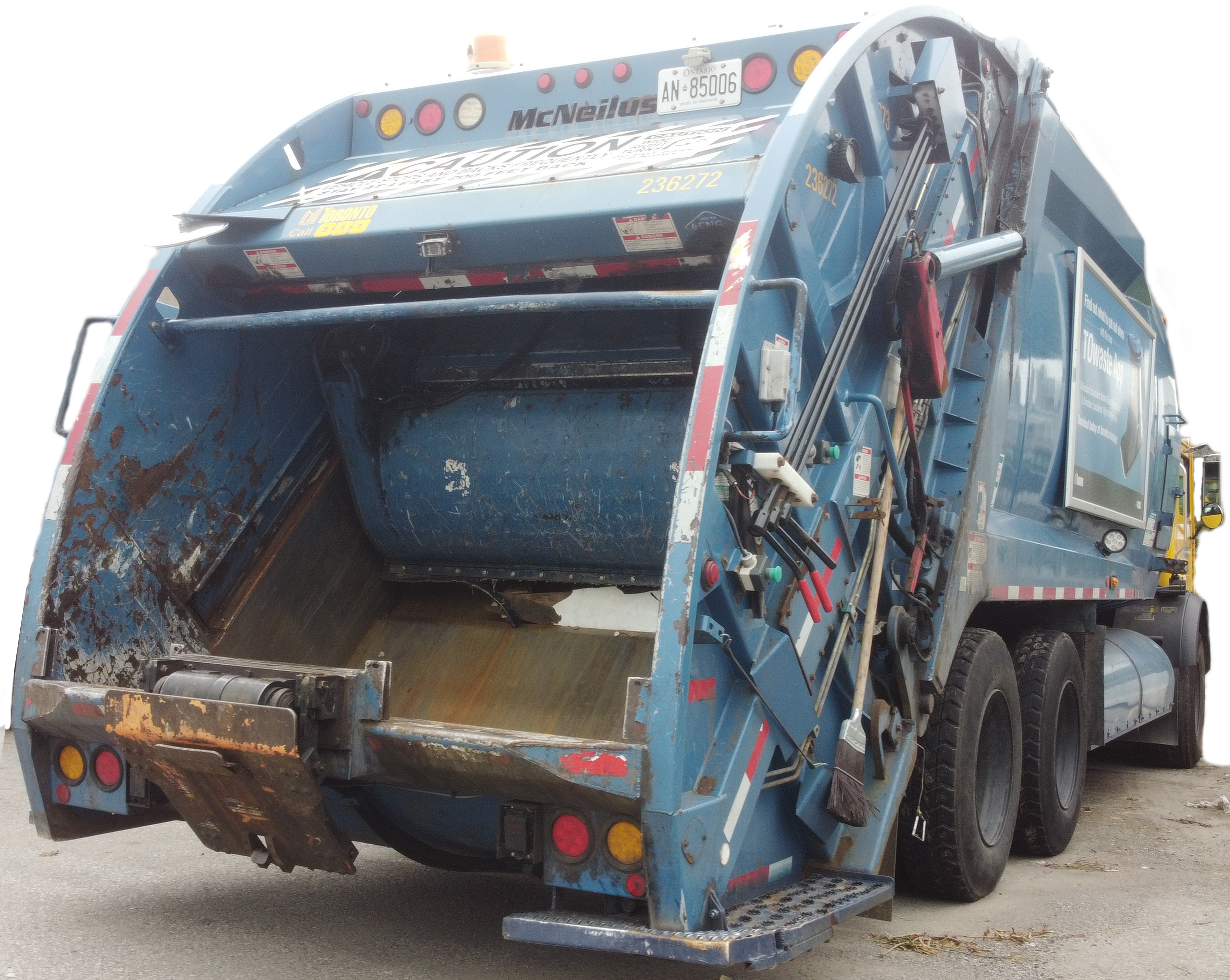 Rear loader garbage truck pictured
